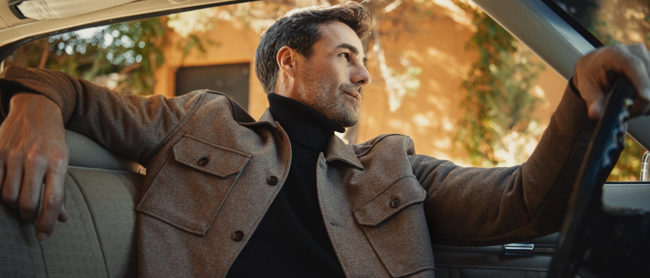 Wool-blend overshirt worn over a roll neck